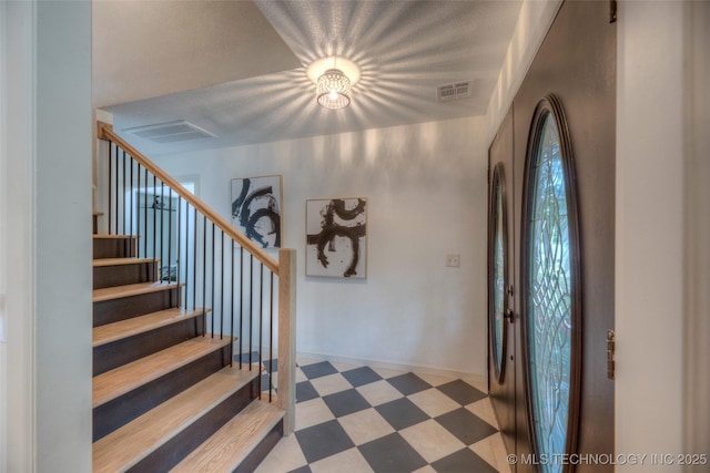 8221 S 74th E Ave, Tulsa, OK 74133 - entryway featuring stairway, tile patterned floors, and baseboards