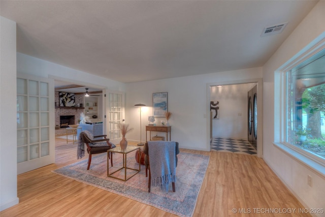 8221 S 74th E Ave, Tulsa, OK 74133 - living room with wood finished floors and a fireplace