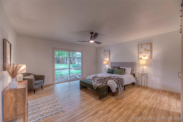 8221 S 74th E Ave, Tulsa, OK 74133 - bedroom featuring access to exterior, wood finished floors, baseboards, and a ceiling fan