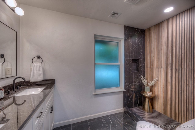 8221 S 74th E Ave, Tulsa, OK 74133 - full bath featuring marble look tile flooring, vanity, baseboards, tiled shower, and recessed lighting