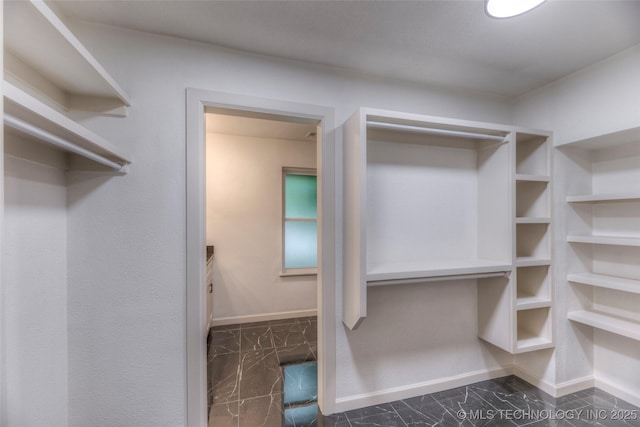 8221 S 74th E Ave, Tulsa, OK 74133 - walk in closet with dark marble finish floors