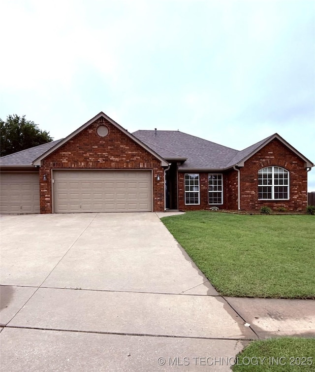 9701 N 98th E Ave, Owasso, OK 74055 - ranch-style house with driveway, a garage, and a front yard