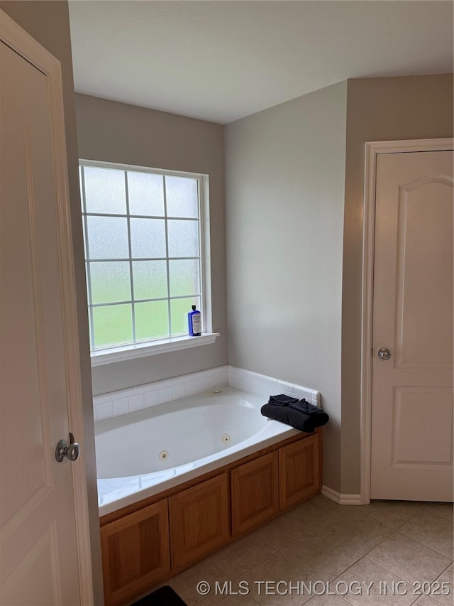 9701 N 98th E Ave, Owasso, OK 74055 - bathroom with a whirlpool tub and tile patterned flooring