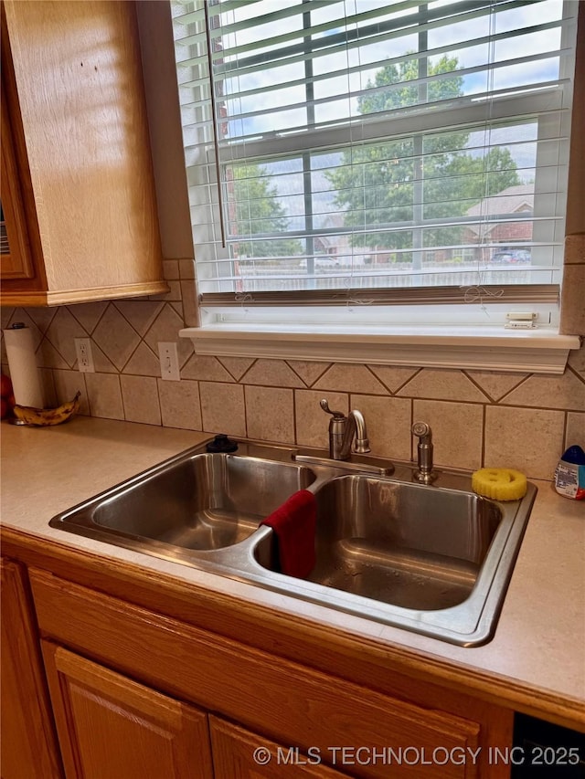 9701 N 98th E Ave, Owasso, OK 74055 - kitchen view of light countertops, brown cabinets, and tasteful backsplash