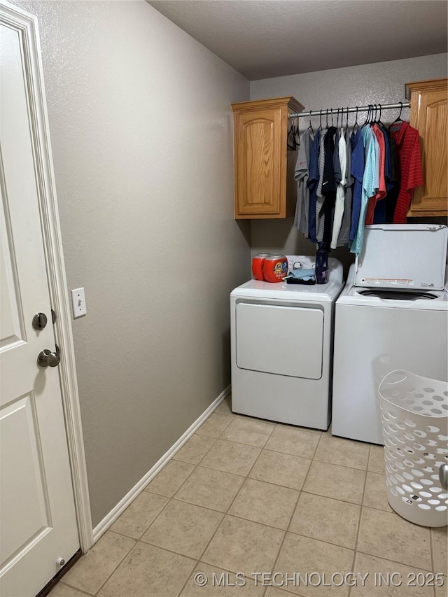 9701 N 98th E Ave, Owasso, OK 74055 - washroom with cabinet space, separate washer and dryer, light tile patterned floors, and baseboards