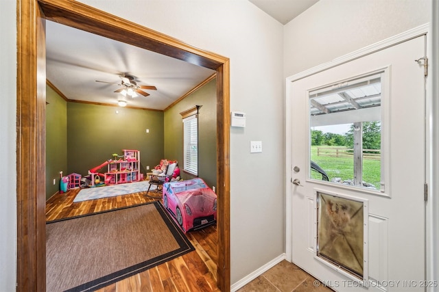 6529 S 159th Ave W, Sapulpa, OK 74066 - doorway to outside featuring baseboards, ceiling fan, and ornamental molding