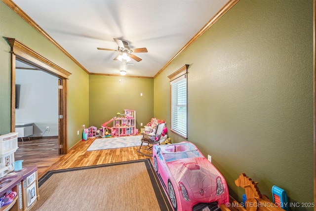6529 S 159th Ave W, Sapulpa, OK 74066 - game room featuring wood finished floors, ornamental molding, and ceiling fan