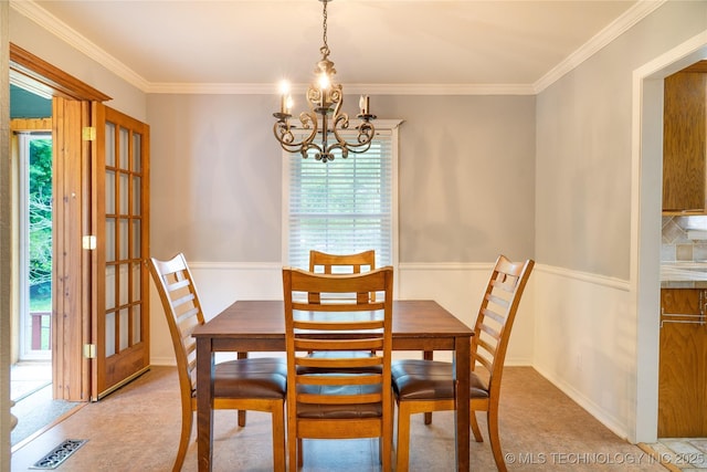4605 Skylane Dr, Sand Springs, OK 74063 - dining space with a chandelier, ornamental molding, and light colored carpet
