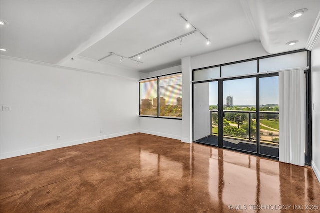 410 W 7th St Unit 1122, Tulsa, OK 74119 - empty room with finished concrete floors, track lighting, baseboards, and recessed lighting
