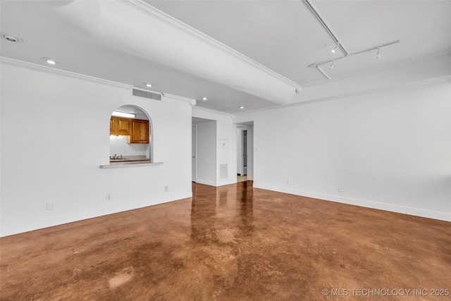 410 W 7th St Unit 1122, Tulsa, OK 74119 - spare room featuring concrete floors, attic access, crown molding, baseboards, and recessed lighting
