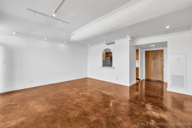 410 W 7th St Unit 1122, Tulsa, OK 74119 - empty room featuring concrete floors, rail lighting, crown molding, baseboards, and recessed lighting