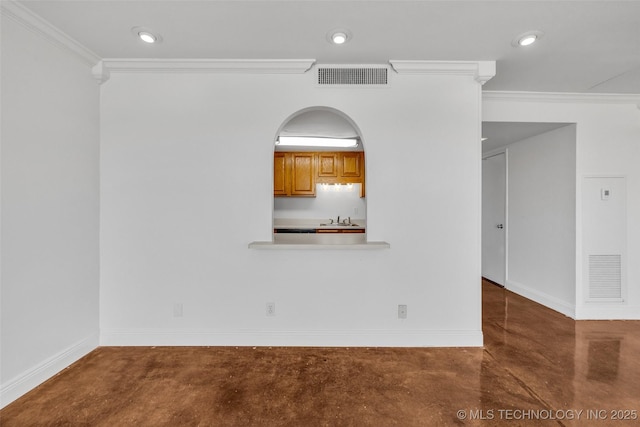 410 W 7th St Unit 1122, Tulsa, OK 74119 - empty room featuring finished concrete floors, crown molding, baseboards, and recessed lighting