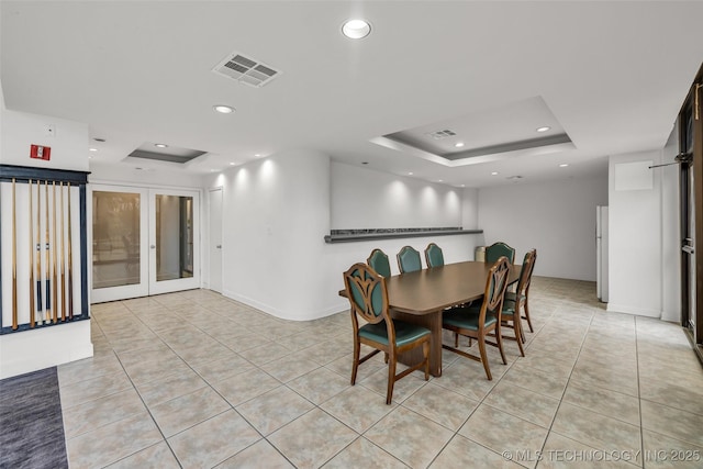 410 W 7th St Unit 1122, Tulsa, OK 74119 - dining room featuring a tray ceiling, light tile patterned floors, french doors, and recessed lighting