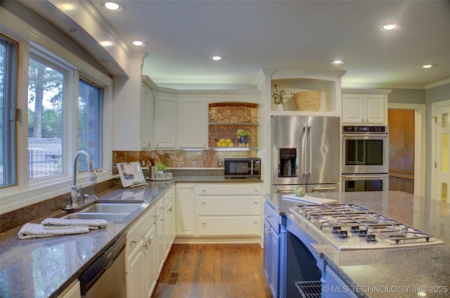 10520 S 69th E Ave, Tulsa, OK 74133 - kitchen featuring appliances with stainless steel finishes, open shelves, plenty of natural light, a sink, and ornamental molding