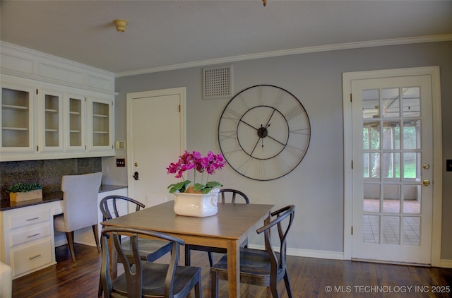 10520 S 69th E Ave, Tulsa, OK 74133 - dining space featuring baseboards, dark wood-style floors, and crown molding