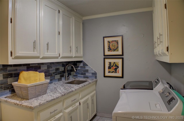 10520 S 69th E Ave, Tulsa, OK 74133 - laundry area with cabinet space, independent washer and dryer, and crown molding