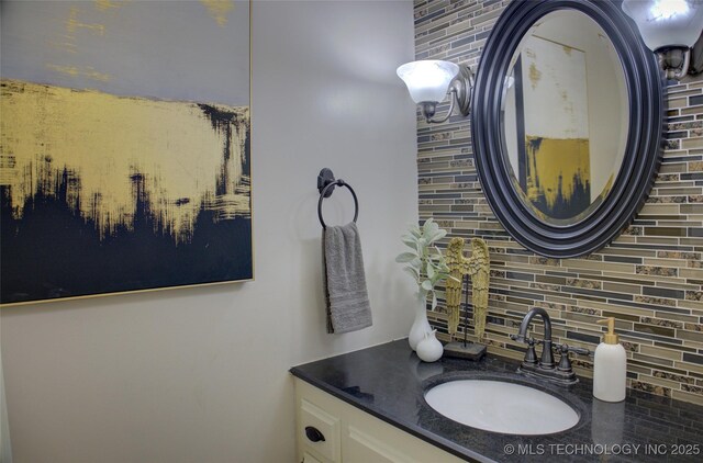 10520 S 69th E Ave, Tulsa, OK 74133 - bathroom featuring tasteful backsplash and vanity