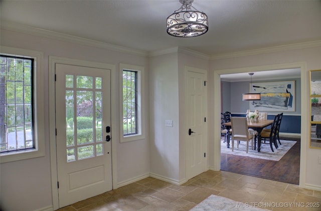 10520 S 69th E Ave, Tulsa, OK 74133 - entrance foyer featuring healthy amount of natural light, baseboards, stone tile floors, and ornamental molding
