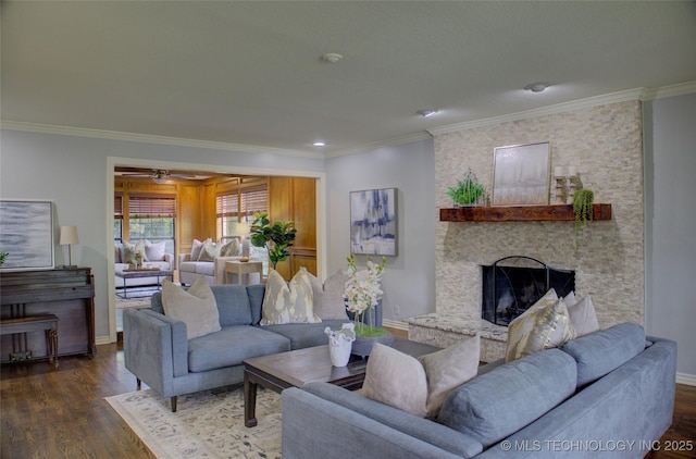 10520 S 69th E Ave, Tulsa, OK 74133 - living area featuring ornamental molding, wood finished floors, baseboards, a stone fireplace, and ceiling fan