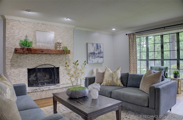 10520 S 69th E Ave, Tulsa, OK 74133 - living area with wood finished floors, crown molding, a stone fireplace, and recessed lighting