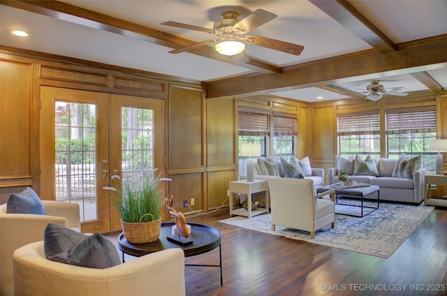 10520 S 69th E Ave, Tulsa, OK 74133 - living room with ceiling fan, beam ceiling, healthy amount of natural light, wood walls, and dark wood-style flooring