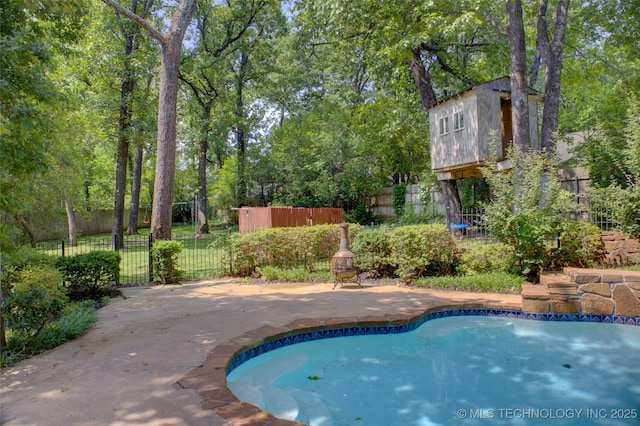 10520 S 69th E Ave, Tulsa, OK 74133 - view of pool featuring a patio area and view of scattered trees