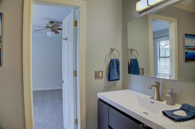 10520 S 69th E Ave, Tulsa, OK 74133 - bathroom featuring ornamental molding, vanity, and ceiling fan