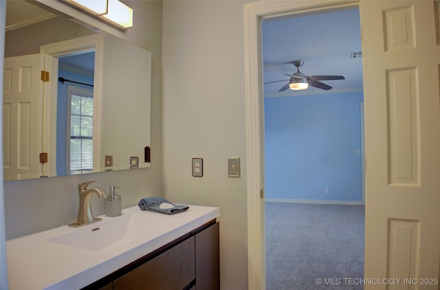 10520 S 69th E Ave, Tulsa, OK 74133 - bathroom with ornamental molding, vanity, a ceiling fan, and baseboards