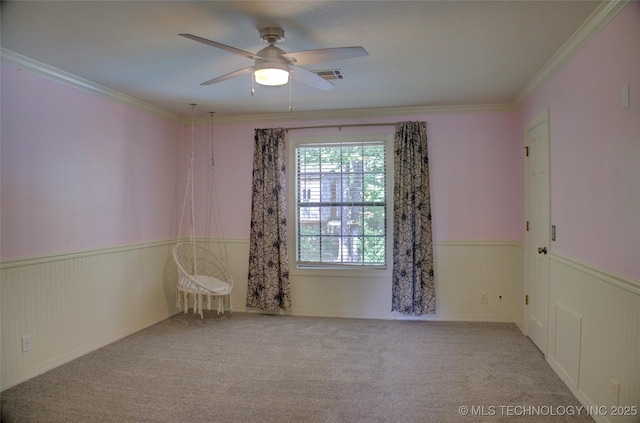 10520 S 69th E Ave, Tulsa, OK 74133 - empty room with wainscoting, a ceiling fan, ornamental molding, and carpet flooring