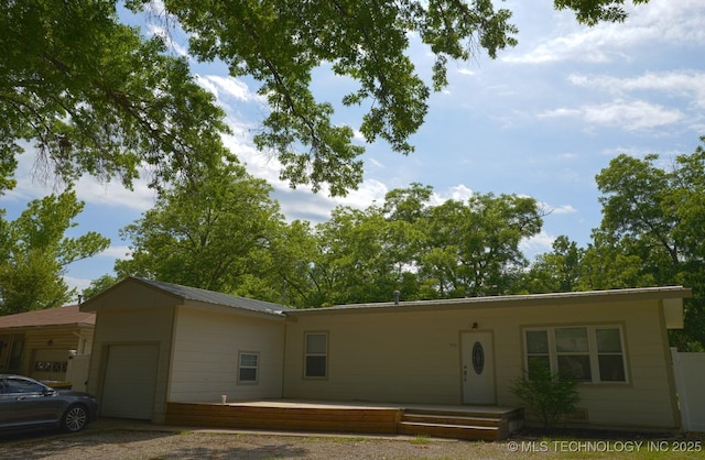 916 S Orchard St, Stillwater, OK 74074 - view of front facade with an attached garage and driveway