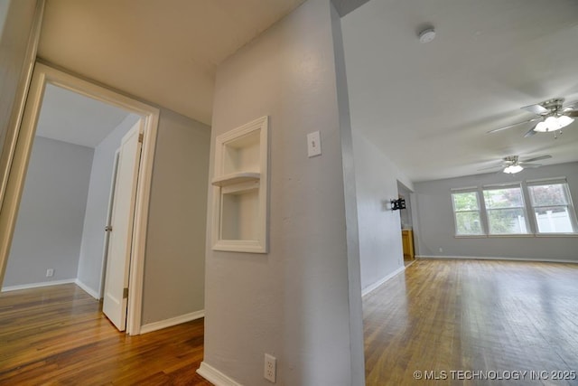 916 S Orchard St, Stillwater, OK 74074 - hallway with wood finished floors and baseboards