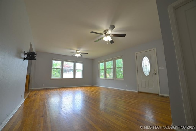 916 S Orchard St, Stillwater, OK 74074 - foyer entrance with hardwood / wood-style flooring, baseboards, and ceiling fan