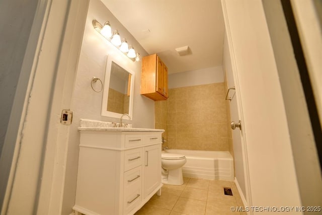 916 S Orchard St, Stillwater, OK 74074 - full bathroom with tile patterned flooring, toilet, and vanity