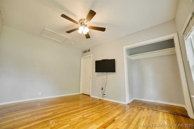 916 S Orchard St, Stillwater, OK 74074 - unfurnished bedroom featuring attic access, light wood finished floors, baseboards, and a closet
