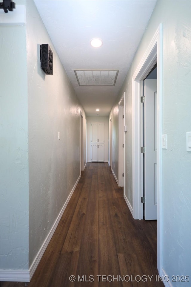 8845 Chestnut Rd, Henryetta, OK 74437 - hall with dark wood-style floors, baseboards, and recessed lighting