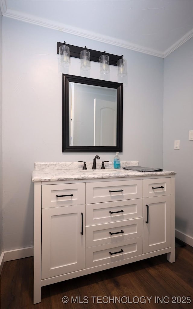 8845 Chestnut Rd, Henryetta, OK 74437 - bathroom with crown molding, vanity, baseboards, and wood finished floors