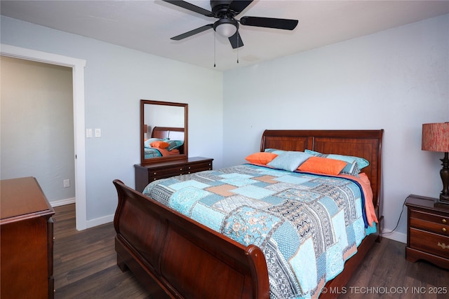 8845 Chestnut Rd, Henryetta, OK 74437 - bedroom with dark wood-style floors, baseboards, and ceiling fan