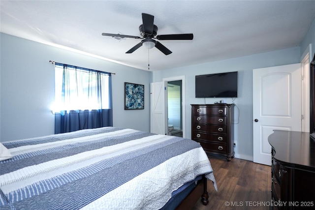 8845 Chestnut Rd, Henryetta, OK 74437 - bedroom featuring dark wood finished floors and ceiling fan
