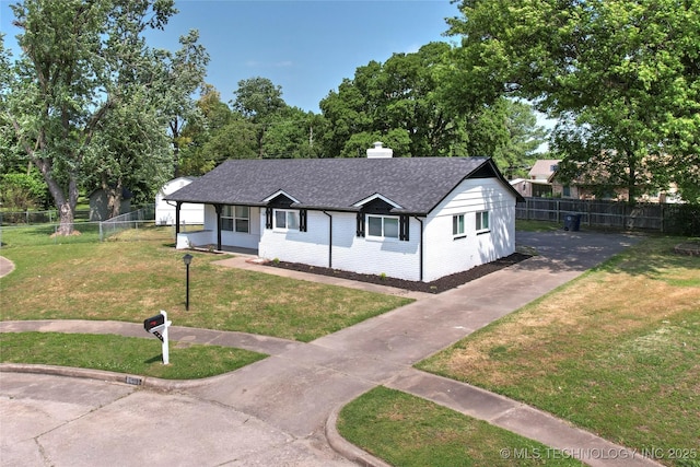 11607 E 24th St, Tulsa, OK 74129 - single story home featuring concrete driveway, a chimney, a shingled roof, and brick siding