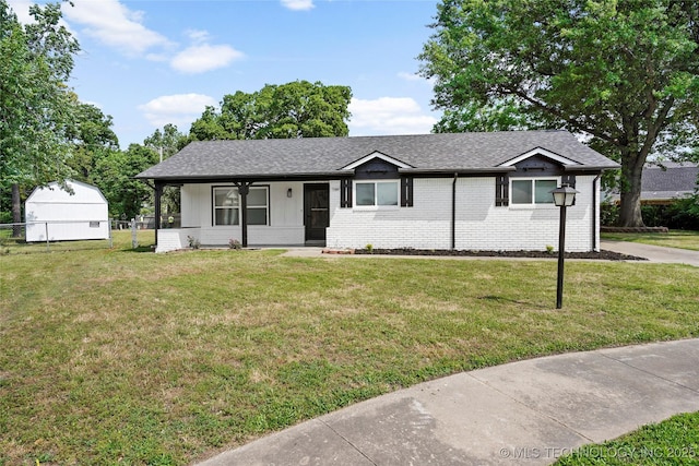11607 E 24th St, Tulsa, OK 74129 - ranch-style house featuring brick siding, roof with shingles, and a porch