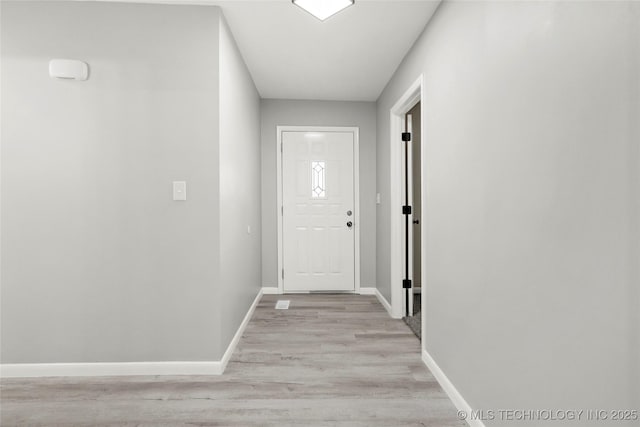11607 E 24th St, Tulsa, OK 74129 - entryway featuring baseboards and light wood-type flooring