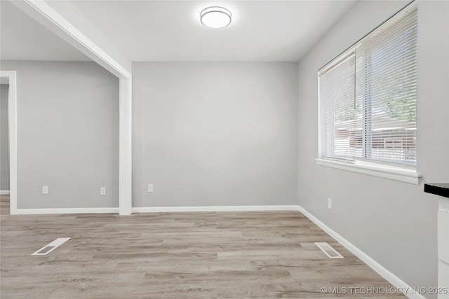 11607 E 24th St, Tulsa, OK 74129 - unfurnished room featuring wood finished floors and baseboards