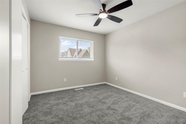 11607 E 24th St, Tulsa, OK 74129 - unfurnished bedroom with carpet flooring, baseboards, and a ceiling fan