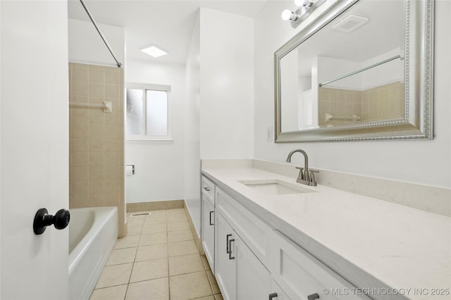 11607 E 24th St, Tulsa, OK 74129 - full bathroom with vanity, tile patterned flooring,  shower combination, and baseboards