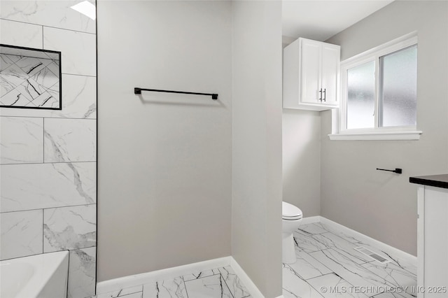 11607 E 24th St, Tulsa, OK 74129 - bathroom with marble finish flooring, toilet, baseboards, and vanity