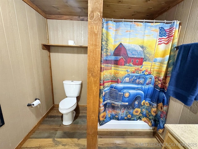 15588 N Sunset Valley Rd, Hulbert, OK 74441 - bathroom featuring wood finished floors, toilet, wooden walls, vanity, and a shower with curtain