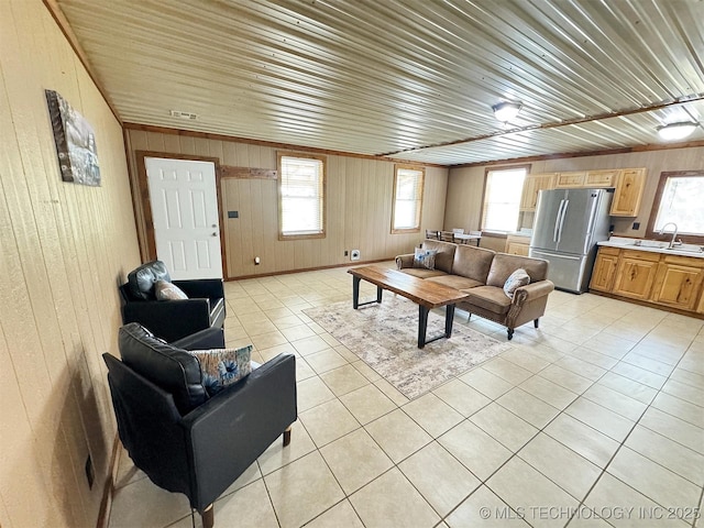 15588 N Sunset Valley Rd, Hulbert, OK 74441 - living area with wooden walls, light tile patterned floors, plenty of natural light, and wooden ceiling