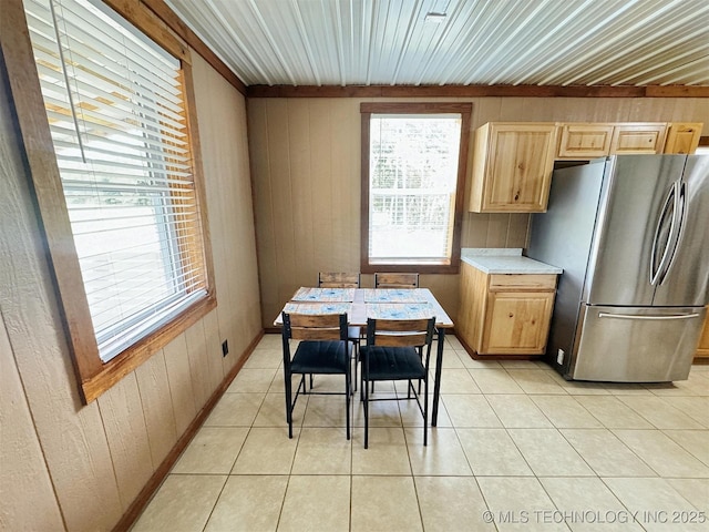 15588 N Sunset Valley Rd, Hulbert, OK 74441 - dining area featuring wood walls and light tile patterned floors