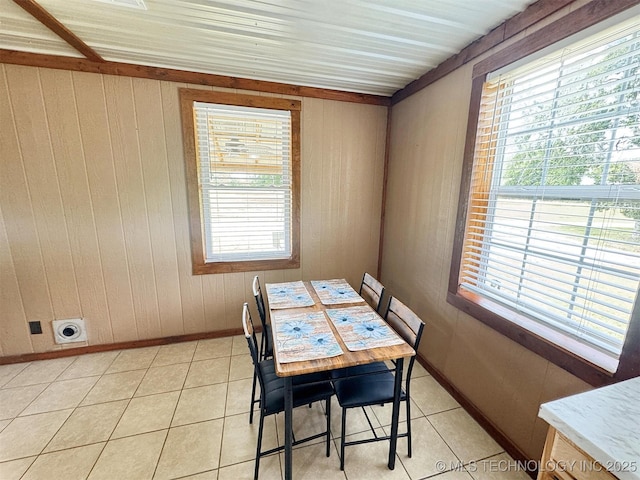 15588 N Sunset Valley Rd, Hulbert, OK 74441 - dining space featuring wooden walls, light tile patterned floors, and baseboards
