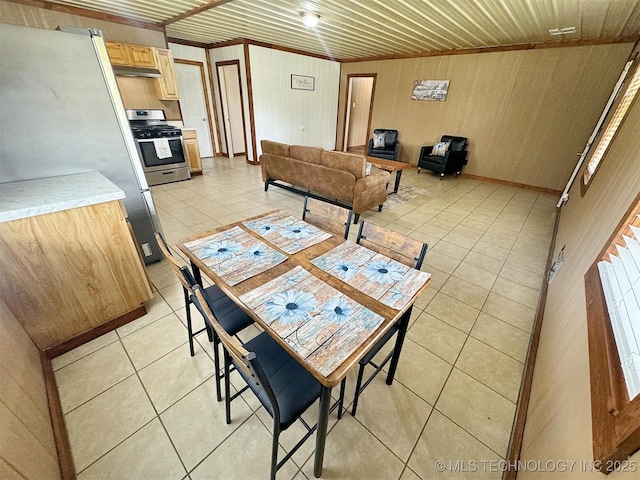 15588 N Sunset Valley Rd, Hulbert, OK 74441 - dining room featuring light tile patterned floors and wood walls